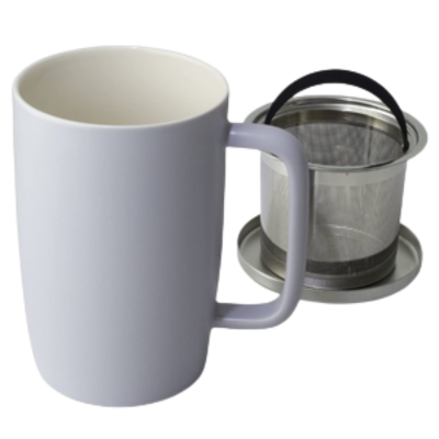White mug with a metal tea infuser on a white background