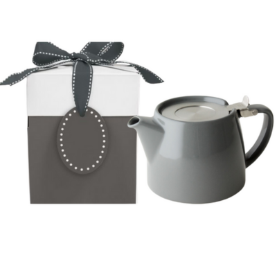 Gray teapot with a matching gift box and bow on a white background