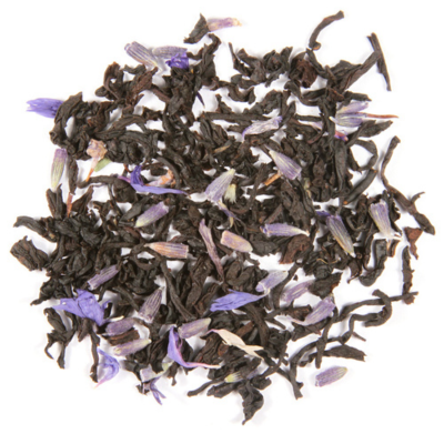 A close-up of loose black tea leaves with pieces of lavender and blue cornflowers, and hints of orange and vanilla.