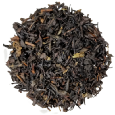 Close-up of black tea leaves on a white background