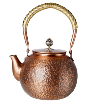 Handmade 44 oz hammered copper tea kettle with brass coiled handle and decorative floral lid knob